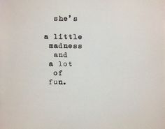 an old typewriter with the words she's a little madness and a lot of fun