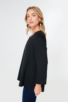 Simple, chic, and classic, the Black Bedford Top is the wardrobe essential that’ll give your closet the refresh it needs. With slightly structured shoulders and a high to low hem, this sophisticated number can be tucked in or out depending on your look. Pair with trousers and flats for an elevated office look or opt for denim and platform heels for an effortless party outfit that’ll have you ready in 5 minutes flat! Scoop neckline Structured shoulders Bracelet length sleeves Relaxed fit Material Chic Solid Blouse For Work, Chic Solid Color Blouse For Work, Classic Solid Blouse For Evening, Chic Workwear Top In Solid Color, Chic Solid Color Workwear Tops, Chic Solid Color Tops For Work, Classic Fall Blouse For Night Out, Classic Blouse For Night Out In Fall, Sleek Formal Tops For Spring