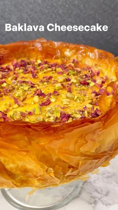 a baked dish is sitting on a glass plate