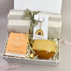 a gift box containing soap, tea, and other items for someone's special occasion