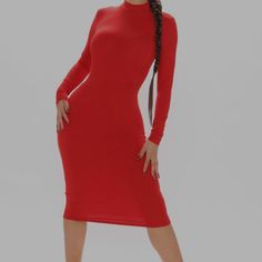 a woman in a red dress posing for the camera with her hands on her hips