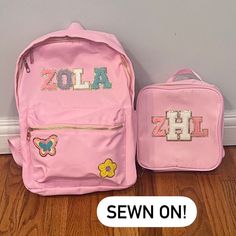 "2 piece set includes backpack and lunchbox Customize this trendy, nylon backpack AND matching lunchbox with your name and/or favorite decorative patches to create your perfect set! This set is perfect for ALL AGES for school, work, camp, travel, and everyday use!  ⭐️Patches are SEWN ON to ensure lasting durability!⭐️ Backpack Details: Material: Lightweight High Quality Nylon Measurements: 15x12x5 inches -Gold zipper closures -2 Side pouches for water bottles This backpack can fit about 6 letter School Bag With Letter Patch For Back To School, School Bags With Letter Patch For Back To School, Pink School Bag With Letter Patch, Pink School Bags With Letter Patch, Back To School Bags With Letter Patch, Backpack And Lunchbox Set, Patch Backpack, Chenille Patches, Letter Patches