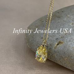 "The pendant pictured is canary yellow simulated diamond #7060 -Approximate total carat weight: approx. 3.60ctw diamond equivalent -Center Stone Size: 12x8mm - approx. 3.60ct diamond equivalent -Center Stone Shape: pear / tear drop -Gem Type: simulated diamond -Stone Clarity: VVS1 -Stone Color: Canary Yellow -Moh's Scale: 8.5 hardness -Metal Type and Purity: 14k yellow gold -Setting: 5 prong basket head -Size: Height with bail approx 15.30mm x Width approx. 8mm -Chain: delicate 14k gold chain / Classic Yellow Diamond Cut Necklace, Yellow Diamond-cut Necklace In Fine Jewelry Style, Yellow Diamond Cut Necklace In Fine Jewelry Style, Yellow 14k Gold Jewelry With Diamond Accents, Oval Yellow Diamond Necklace, Yellow Pear-shaped Fine Jewelry, Yellow Gold Pear-shaped Jewelry With Prong Setting, Yellow Brilliant Cut Cubic Zirconia Necklaces, Yellow Diamond Teardrop Jewelry