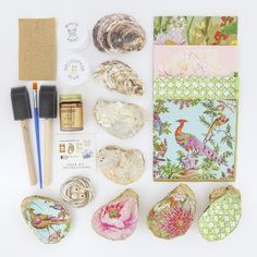 an assortment of crafting supplies laid out on a white surface