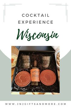 the cocktail experience wisconsin gift box is open and has two oranges in it, one with