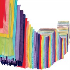 an assortment of multicolored cloths are arranged in rows and stacked on top of each other