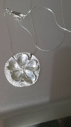 Handmade by Alison finished by yours truly. Love the small details to this pendant. The curves and texture make this pendant so unique. Sakura center (cherry blossom). Solid sterling silver and comes with match 18 inch Cardano style chain with lobster clasp. Pendant measures approximately 1 inch in diameter. Luxury Nature-inspired Sterling Silver Necklace, Cheap Sterling Silver Charm Necklaces With Round Pendant, Affordable Sterling Silver Charm Necklaces With Round Pendant, Luxury Silver Flower Charm Necklace, Luxury Nature-inspired Sterling Silver Necklaces, Cherry Blossom Circle, Chunky Pendant Necklace, Sakura Necklace, Cherry Blossom Necklace