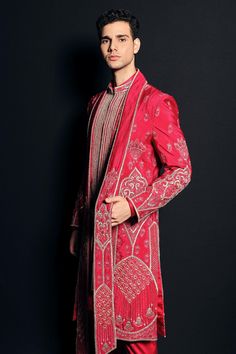 Hot pink embroidered jacket style sherwani in sequin and bead work. Paired with embroidered stole, solid kurta and pant.
Component: 4
Pattern: Embroidered
Type Of Work: Sequins, Bead work
Neckline: Mandarin collar
Sleeve Type: Full sleeves
Fabric: Raw silk, Mashru satin
Color: Pink
Other Details: 
Asymmetric hem sherwani
Bead and sequins work
Occasion: Wedding, Reception - Aza Fashions Red Sherwani With Intricate Embroidery For Reception, Red Embroidered Sherwani For Reception, Red Bollywood Style Sherwani In Jamawar, Bollywood Style Pink Bandhgala With Dabka Work, Pink Bollywood Bandhgala With Dabka Work, Red Jamawar Sherwani With Resham Embroidery, Pink Bandhgala With Dabka Work In Traditional Drape, Festive Pink Sherwani With Dabka Work, Pink Bollywood Sherwani With Intricate Embroidery