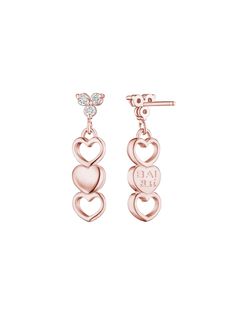 Inspired by the Graces earrings, these sustainable three heart 14K Gold designs exude timeless luxury. With a diamond accent, these earrings are bound to elevate your style. Stack them with the Cupid Studs or style them with Love Collection Rings and Necklaces. Handcrafted in New York & Shipping Worldwide. Luxury Rose Gold Heart Earrings, Elegant Rose Gold Heart Cut Earrings, Elegant Earrings With Diamond Accents For Valentine's Day, Elegant Diamond Accent Earrings For Valentine's Day, Elegant Diamond Accented Earrings For Valentine's Day, Heart-shaped Rose Gold Earrings With Diamond Accents, Heart Shaped Rose Gold Earrings With Diamond Accents, Elegant Double Heart Earrings With Diamond Accents, Elegant Rose Gold Diamond Heart Earrings