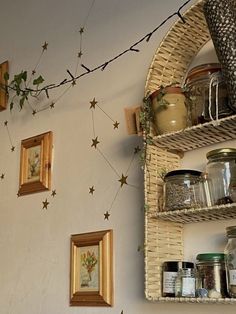 the wall is decorated with gold stars and jars