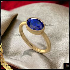 A blue sapphire ring is a beautiful ring with a shiny blue gem. It looks elegant and adds a touch of charm to your finger. The blue color is eye-catching and makes the ring special. People like wearing it for its pretty and classic style. Whether for everyday wear or special occasions, a blue sapphire ring is a timeless accessory that stands out with its unique and stunning blue hue. ➜ Benefits of Blue Sapphire Ring-       ▶ A blue sapphire ring exudes a timeless and elegant charm.       ▶ The v Classic Blue Sapphire Ring With Oval Cabochon, Blue Sapphire Rings With Oval Cabochon Shape, Blue Oval Cabochon Sapphire Ring For Anniversary, Elegant Blue Oval Cabochon Sapphire Ring, Elegant Blue Sapphire Oval Cabochon Ring, Oval Sapphire Ring With Polished Finish As Gift, Blue Oval Ring With Bezel Setting, Blue Oval Birthstone Ring With Bezel Setting, Oval Sapphire Ring