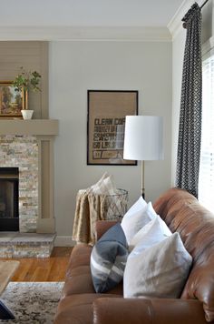 a living room filled with furniture and a fire place