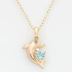 Oceans of beauty. Featuring a heart-cut blue topaz stone and tiny diamond accent, this 18k gold-over-sterling silver dolphin pendant is dazzling. Wear this charming necklace with absolutely any ensemble. Click on this JEWELRY & WATCHES GUIDE to learn about fit, styles, materials and more! Brass chain offers a lovely glow. Necklace comes in a gift box. Details: 7/8-in. pendant 18-in. chain Spring-ring clasp 18k gold over sterling silver & brass Image(s) may be enlarged to show detail. Diamond wei Blue Topaz Necklace With Diamond Accents, Blue Topaz Necklaces With Diamond Accents For Gift, Blue Topaz Necklace With Diamond Accents For Gift, Topaz Necklaces With Diamond Accents For Gift, Topaz Necklace With Diamond Accents As Gift, Topaz Necklace With Diamond Accents For Gift, Heart Cut Topaz Jewelry As Gift, Heart Cut Topaz Jewelry Gift, Heart Cut Topaz Jewelry For Gifts