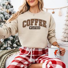 Coffee Weather Shirt - Cozy Fall and Winter Crewneck Sweatshirt  for Coffee Lovers, Cute Gift for Her or Him 🕒 PRODUCTION TIME: 1-3 businese days (Usually 2 days) 🚚 SHIPPING TIME: 2-5 businese days (Usually 3 days) 📄 PRODUCT DESCRIPTION: Gildan Short Sleeve Unisex T-shirt Exceptionally cotton with a premium print. 100% cotton (fibre content may vary for different colors) Medium fabric (5.3 oz/yd² or 180 g/m²) Fits true to size Our Unisex Tee is a relaxed fit that feels soft and cozy. Men may Coffee Letter Print Tops For Fall, Coffee Colored Tops With Letter Print For Fall, Coffee-colored Graphic Print Sweatshirt For Fall, Coffee Long-sleeve Sweatshirt For Winter, Winter Coffee Cotton Sweatshirt, Coffee Crew Neck Sweatshirt For Winter, Coffee Colored Crew Neck Sweatshirt For Winter, Winter Coffee-colored Crew Neck Sweatshirt, Coffee Color Crew Neck Sweatshirt For Winter