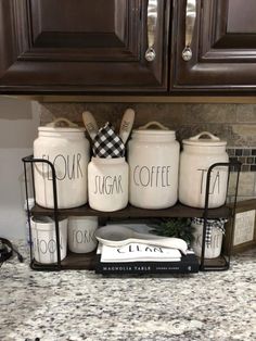 kitchen canisters are stacked on top of each other