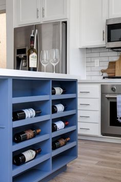 a kitchen filled with lots of bottles of wine