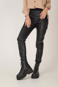 STRETCHY BLACK VEGAN LEATHER LEGGINGS IN SKINNY FIT GARMENT FEATURES: * Classic, timeless silhouette in a skinny leg fit * Soft elasticated waist in black ribbed stretch for super comfy dressing * Visible front decorative stitches for sublime high-end detail * Made from quality high stretch vegan leather * Comes unlined SIZING & FITTING: Model is 170cm tall and wears size S. This piece is available in sizes XS-XXL. NB: This product could be customized according to your measurements. Please l Trendy Winter Leggings For Streetwear, Edgy Fall Streetwear Leggings, Trendy Winter Streetwear Leggings, Black Leather Pants For Alternative Fashion In Fall, High Waist Leggings For Fall Streetwear, Edgy Thigh-high Leggings For Fall, Tight Faux Leather Leggings For Winter, Edgy Leather Pants For Alternative Fashion In Fall, Alternative Style Black Faux Leather Bottoms