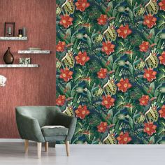 a chair in front of a wallpaper with red flowers and green leaves on it