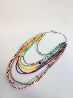 Beautiful Multiple strand seedbead necklace. The necklace is an one of a kind adjustable piece :) Hand made with love :) Multicolor Double Strand Beaded Chain Necklace, Rainbow Necklaces With Tiny Round Beads, Multicolor Beaded Multi-strand Layered Necklace, Multicolor Double Strand Layered Necklace With Beaded Chain, Multicolor Double Strand Layered Necklace, Layered Necklace With Colorful Round Beads For Gifts, Rainbow Necklace With Tiny Round Beads, Long Multicolor Necklace With Tiny Beads, Multicolor Bohemian Layered Necklace With Round Beads