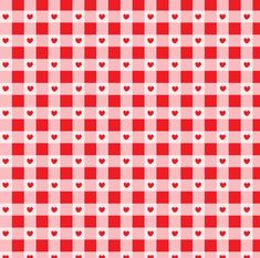 a red and white checkered tablecloth with hearts in the center, as if for valentine's day