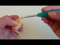 someone crocheting the end of a piece of yarn