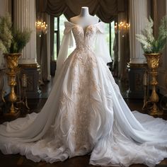 a wedding dress on display in front of a window with columns and chandeliers