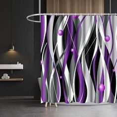 the shower curtain is decorated with purple and white designs on it's side,