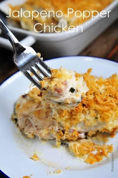 a white plate topped with food and a fork