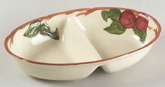 a white bowl with red flowers on it