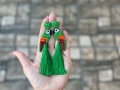 Statement beaded green parrot bird embroidered tassel earrings. Bohemian boho tropical earrings length: with tassels - 4.5" (11.2 cm) ❤ CUSTOM ORDERS It is ABSOLUTELY HANDMADE. So if you like this item in a different color or size, send me a message please. I will send you a link for a "custom order" and you'll be able to place the order there. Please feel free to communicate with me. SHIPPING Item will be shipped carefully packed in a GIFT BAG!! Shipping cost includes tracking number! -If item is ready to ship I will send it within 1-2 bussines days after payment confirmation. -If item is marked as made to order it will be made and shipped within 2-5 days. -NOTE: Please be sure to give me the correct address for shipping your purchase. I will always ship to your ETSY ADDRESS unless specif Green Parrot Bird, Tropical Earrings, Parrot Bird, Green Bead, Tassel Earrings, Parrot, Statement Earrings, Beaded Jewelry, Jewelry Earrings Dangle