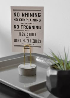 there is a sign on the tray that says no whinening, no complaning, no frowing