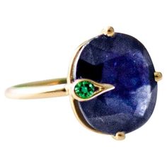 This contemporary Engagement Peacock ring is in 18 karat yellow gold with unheated natural oval cut vivid corn flower blue sapphire, 4,03 carats, 9,67x7,45 mm, AIG certified, and small round emerald. The ring is easy to wear, and the gem catches eye's attention. The collection is connected to the old pagan myth about two birds of paradise: Sirin and Alkonost. One of the birds may have peacock feathers. This ring can be ordered any size. Corn Flower Blue, Corn Flower, Peacock Ring, Fancy Sapphire, Contemporary Engagement Rings, Yellow Gold Engagement Ring, Round Sapphire, Flower Blue, Blue Sapphire Diamond