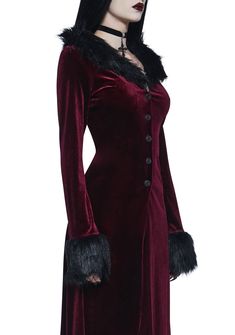 like a phoenix, you will rise. This long length duster jacket has a velvet construction, a faux fur collar and cuffs, rose-engraved front button closures, long sleeves, and side slits. Gothic Long Sleeve Velvet Outerwear, Long Sleeve Velvet Costume Outerwear, Long Sleeve Velvet Outerwear For Costume, Velvet Costume Outerwear For Fall, Winter Velvet Costume Outerwear, Velvet Outerwear For Costume, Winter Velvet Outerwear, Winter Velvet Outerwear With Button Closure, Fitted Velvet Outerwear For Winter