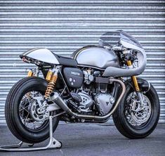 a motorcycle parked in front of a garage door