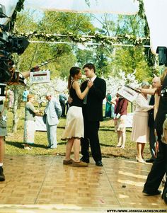 a man and woman dancing on the dance floor in front of an outdoor wedding ceremony