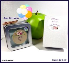 an apple, gift box and balloon on a table with the words june giveaway