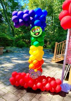 a bunch of balloons that are in the shape of a tree with an octopus on it