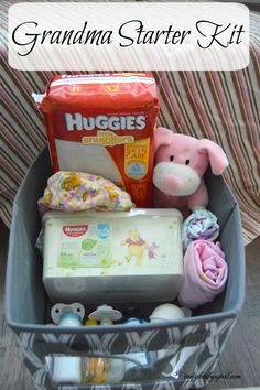 a baby's diaper in a basket with the words grandma starter kit on it