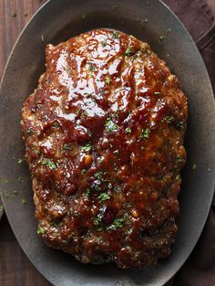 the meat is covered in sauce and garnished with parsley