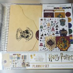 the harry potter planner set is packed with stickers and magnets, including hogwart's crest