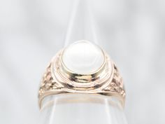 This sophisticated solitaire ring features a moonstone surrounded by a finely crafted yellow gold band with decorated shoulders. Its elegant silhouette is perfect for special occasions and makes a dazzling statement of beauty and grace.Metal: 10K Yellow GoldGem: Moonstone 4.67 CaratsGem Measurements: 9.4 x 13.3 mm, OvalRing Size: 9.25Marks: "DORRETY 10KT" Stamped on the inside band Formal White Moonstone Ring, Classic Moonstone Ring For Formal Occasions, Formal White Gold Moonstone Ring In 14k, Formal 14k White Gold Moonstone Ring, Classic Formal Moonstone Ring With Center Stone, Heirloom Moonstone Ring For Formal Occasions, Heirloom White Moonstone Ring For Formal Occasions, Classic Moonstone Oval Cabochon Ring For Wedding, Heirloom Yellow Gold Moonstone Ring For Formal Occasions