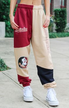 These Florida State Patched sweats are the best blend of coziness and fashion. Embellished with black and beige patches featuring "Florida State" on the leg, these sweats are perfect for tackling the cold, trekking to class, or showing off your Nole pride. Pair them with some chunky white sneakers and a sweatshirt for a delightfully adorable and comfortable outfit! Details: *OFFICIALLY LICENSED* Soft, Thick Fabric Material 65% Polyester, 35% Cotton Graphics on both legs, Elastic Waistband, Cinch Sporty Beige Sweatpants For Streetwear, Brown Sweatpants For Streetwear In Fall, Brown Cotton Joggers For Streetwear, Sporty Cotton Patchwork Pants, Fall Sporty Brown Joggers, Sporty Brown Joggers For Fall, Brown Sporty Sweatpants For Fall, Sporty Brown Sweatpants For Fall, Sporty Cotton Sweatpants With Contrast Color