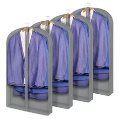 four racks with shirts hanging on them in front of a white background and one is gray