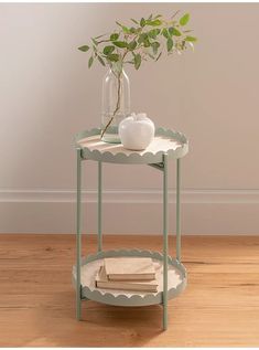 a small table with a plant on top