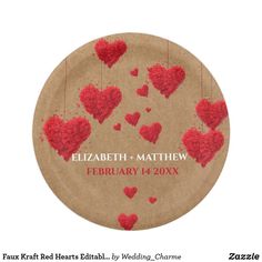 a paper plate with red hearts hanging from the strings on it's side, which reads elizabeth and matthew