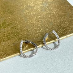 14KT white gold small, twist, pave diamond huggie hoop earrings. Classic design with a twist! Length: 13.67mm Width: 12.77mm Weight: 1.80 grams .357 carat lab-created diamonds Post, notch and lock closure Stamped 14k Solid 14k gold Diamond Teardrop Huggie Earrings With Accents, Diamond Teardrop Huggie Earrings With Diamond Accents, Teardrop Diamond Huggie Earrings With Accents, Teardrop Diamond Huggie Earrings With Diamond Accents, Silver Teardrop Hoop Earrings With Diamond Accents, Anniversary Teardrop Cubic Zirconia Huggie Earrings, Fine Jewelry Teardrop Huggie Earrings With Diamond Accents, Teardrop Huggie Earrings With Diamond Accents, Teardrop White Gold Diamond Hoop Earrings