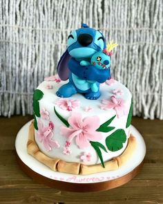 a birthday cake decorated with an image of stitch