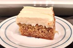 a piece of cake sitting on top of a white plate with blue trim around it