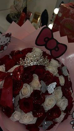 a bouquet of roses with hello kitty on it