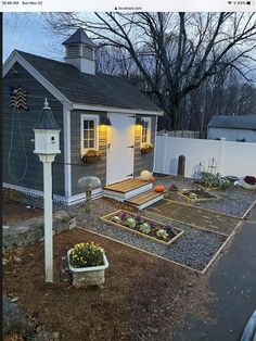 a small house with a garden in the front yard